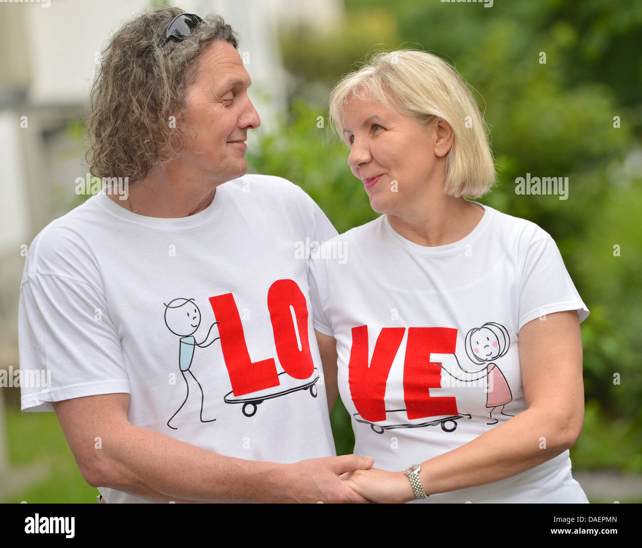 Elisabeth and Jurek Sitarski wear partner shirts designed by their son
