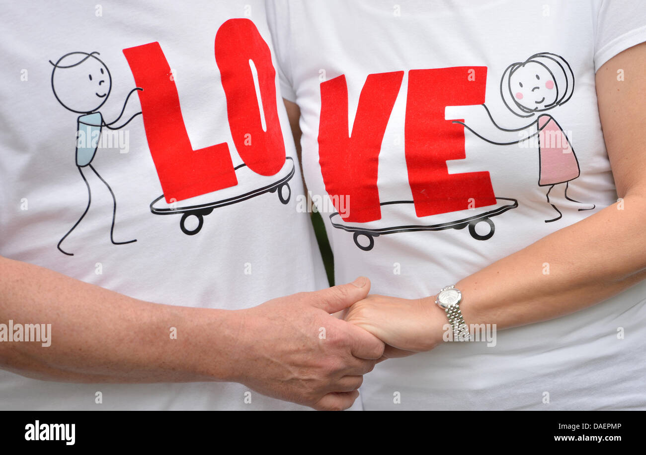 Elisabeth and Jurek Sitarski wear partner shirts designed by their son