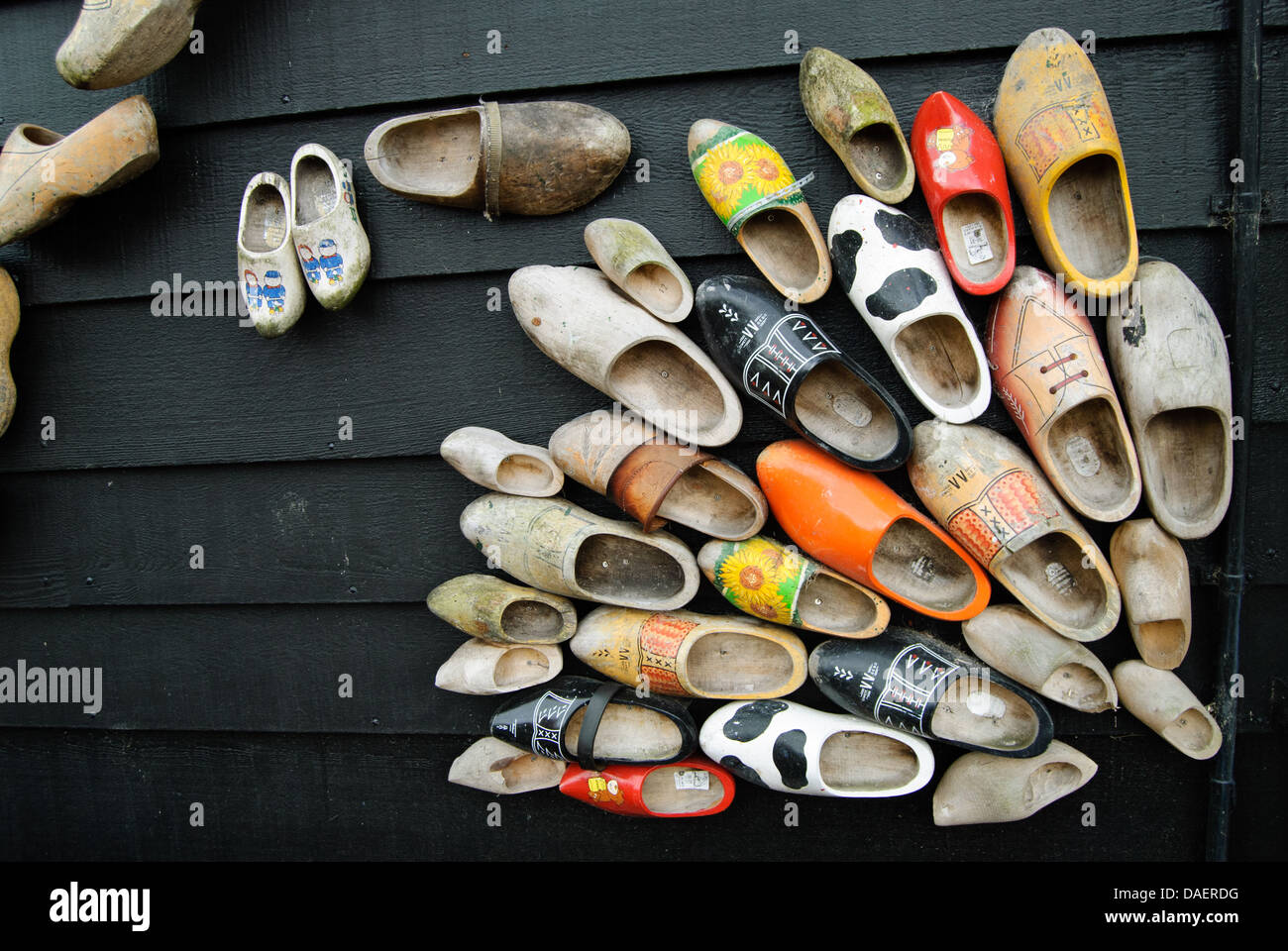 A house wall decorated by used Dutch clogs. Stock Photo