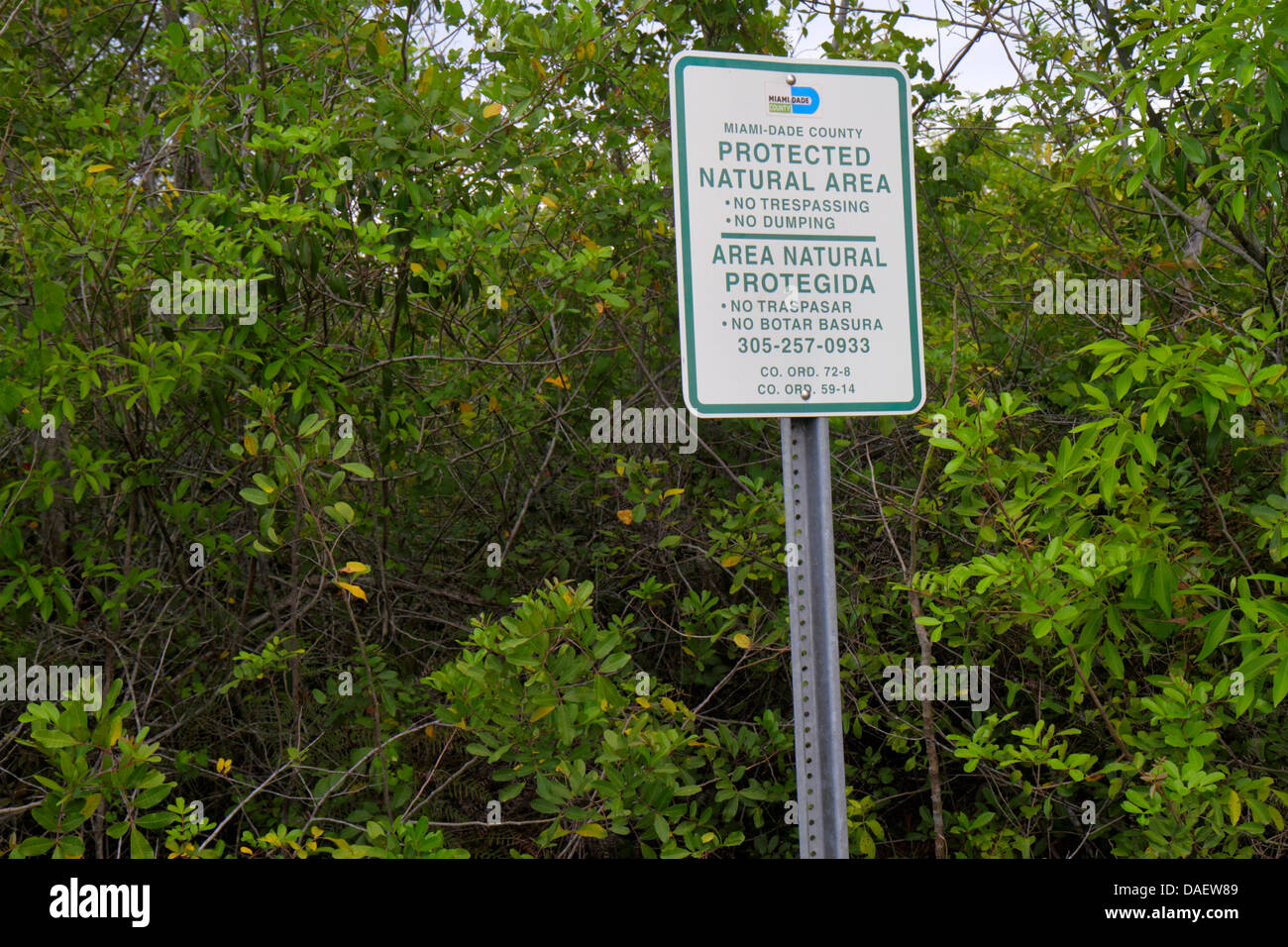 Miami Florida,Homestead,Redland,Navy Wells Pineland Preserve,sign,protected natural area,ally endangered lands,land management,bilingual,Spanish Engli Stock Photo