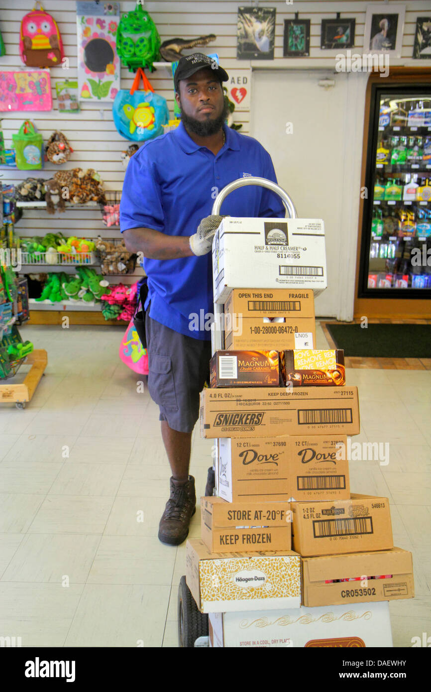 Fort Ft. Lauderdale Weston Florida,Fort Ft. Lauderdale,Sawgrass Recreation Park,Black Blacks African,man men male adult adults,delivery,dolly,cart,box Stock Photo