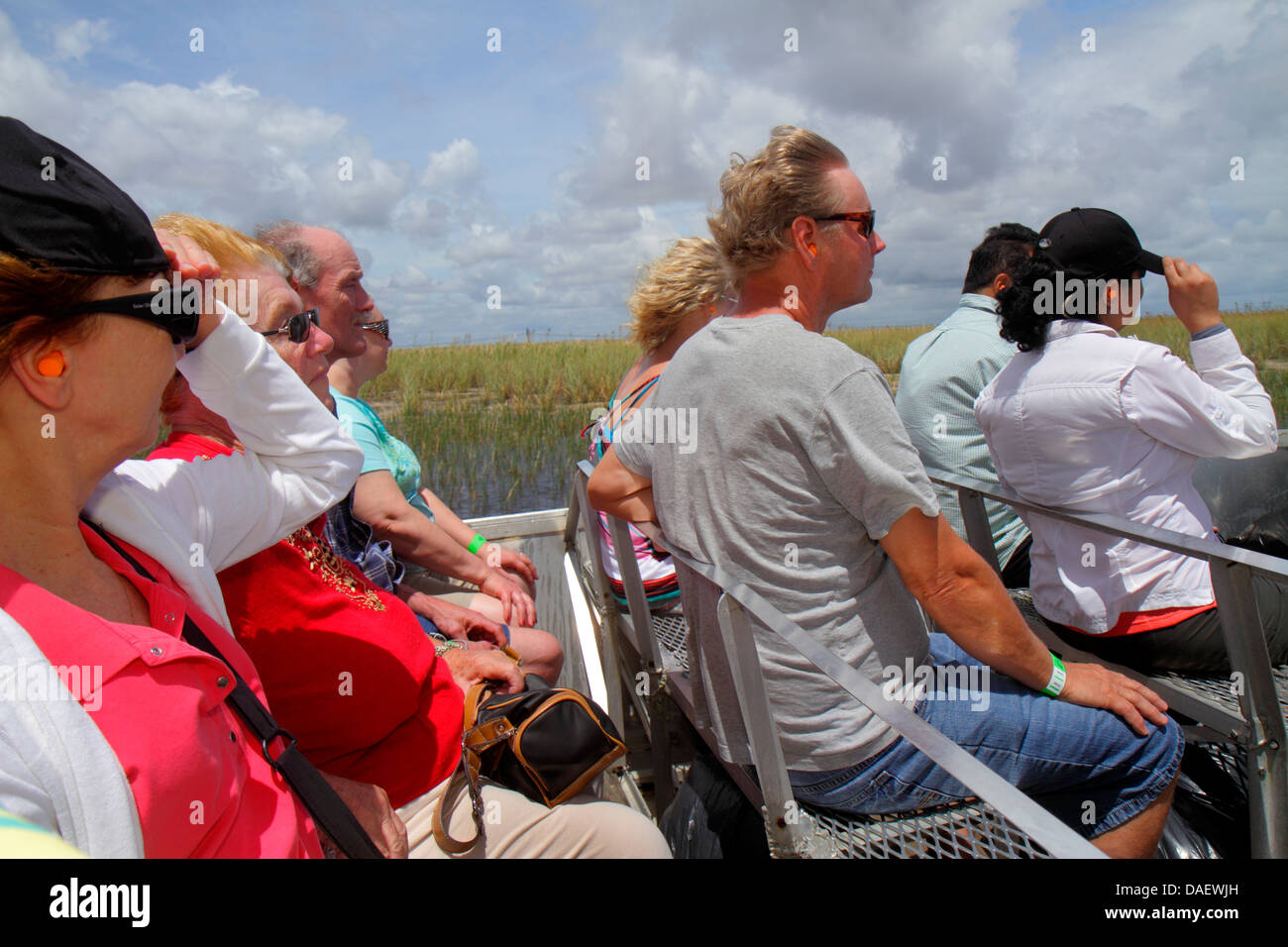 Fort Ft. Lauderdale Weston Florida,Fort Ft. Lauderdale,Sawgrass Recreation Park,Everglades,riders airboat ride,wind,holding onto hat,adult adults woma Stock Photo