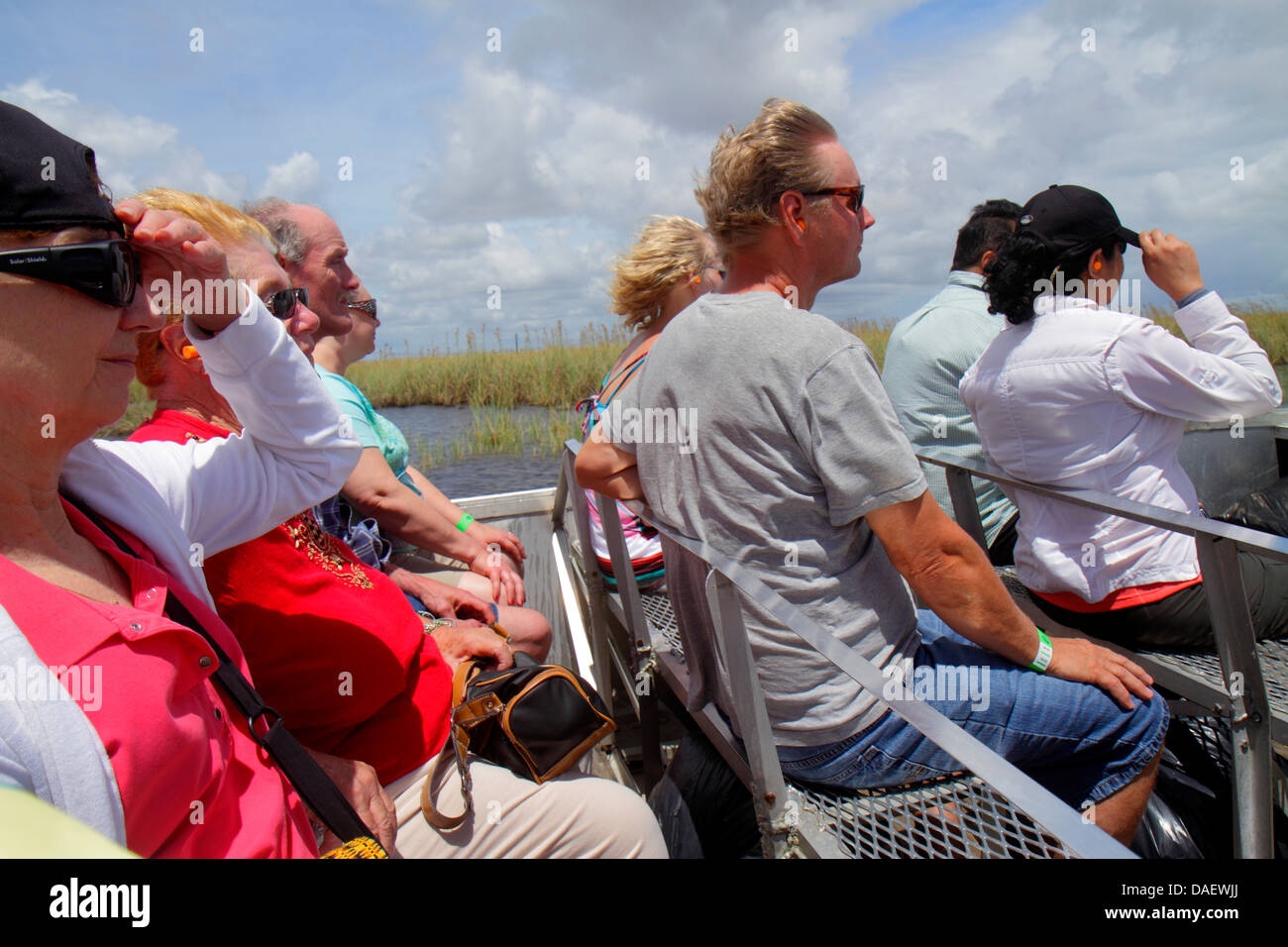 Fort Ft. Lauderdale Weston Florida,Fort Ft. Lauderdale,Sawgrass Recreation Park,Everglades,riders airboat ride,wind,holding onto hat,woman female wome Stock Photo