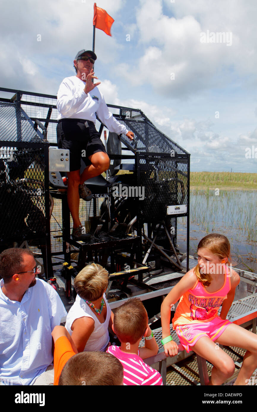 Fort Ft. Lauderdale Weston Florida,Fort Ft. Lauderdale,Sawgrass Recreation Park,Everglades,riders airboat ride,loud noise,holding hand finger over ear Stock Photo