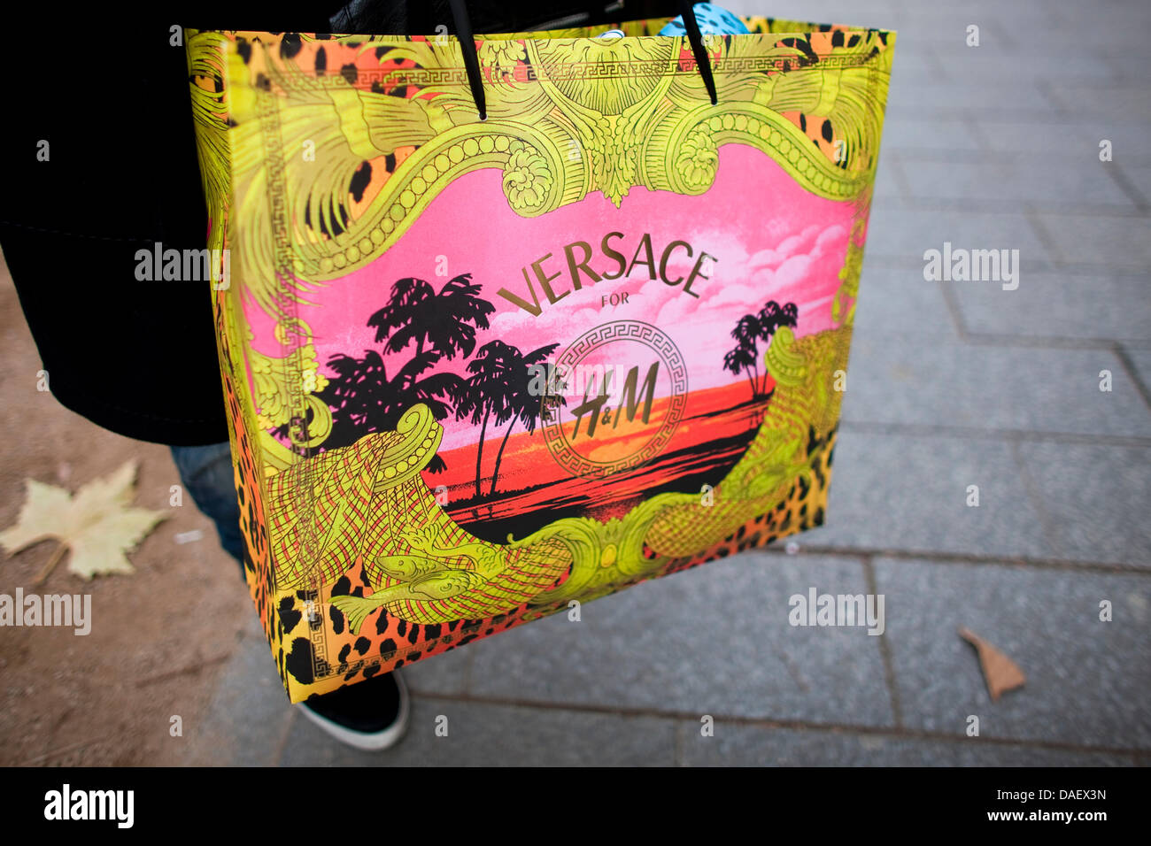 Pascal presents his shopping bag in front of a H&M store in Duesseldorf,  Germany, 17 November 2011. The collection 'Versace' is introduced to the  public on the same day. Photo: Rolf Vennenbernd