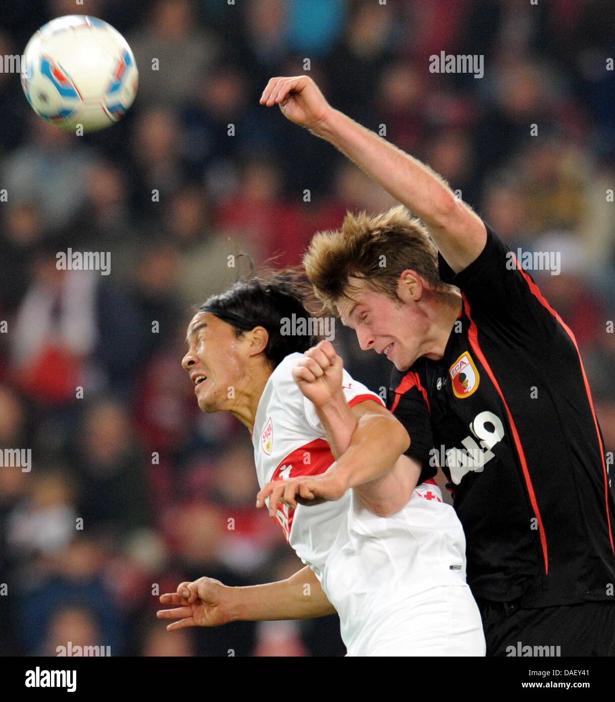 Stuttgart's Shinji Okazaki (L) fights for the ball with Augsburg's Jan-Ingwer Callsen-Bracker (R) during the German Bundesliga first division soccer match between VfB Stuttgart and FC Augsburg at the Mercedes-Benz Arena in Stuttgart, Germany, 20 November 2011. Photo: Bernd Weissbrod  (ATTENTION: EMBARGO CONDITIONS! The DFL permits the further  utilisation of the pictures in IPTV, m Stock Photo