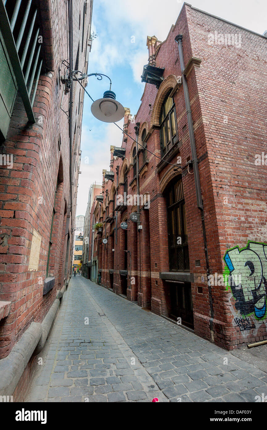 An inner city Melbourne cobbled alley and warehouses converted to homes