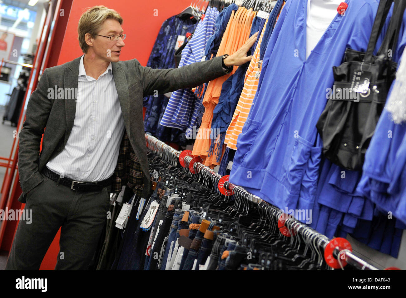 KiK CEO Michael Arretz stands inside a branch of the textile discount store KiK in Solingen, Germany, 22 November 2011. According to Arretz, KiK wishes to expand its business to Poland on time before the European Football Championship. Until 2015 shops in Germany are to be modernized. Photo: MARIUS BECKER Stock Photo