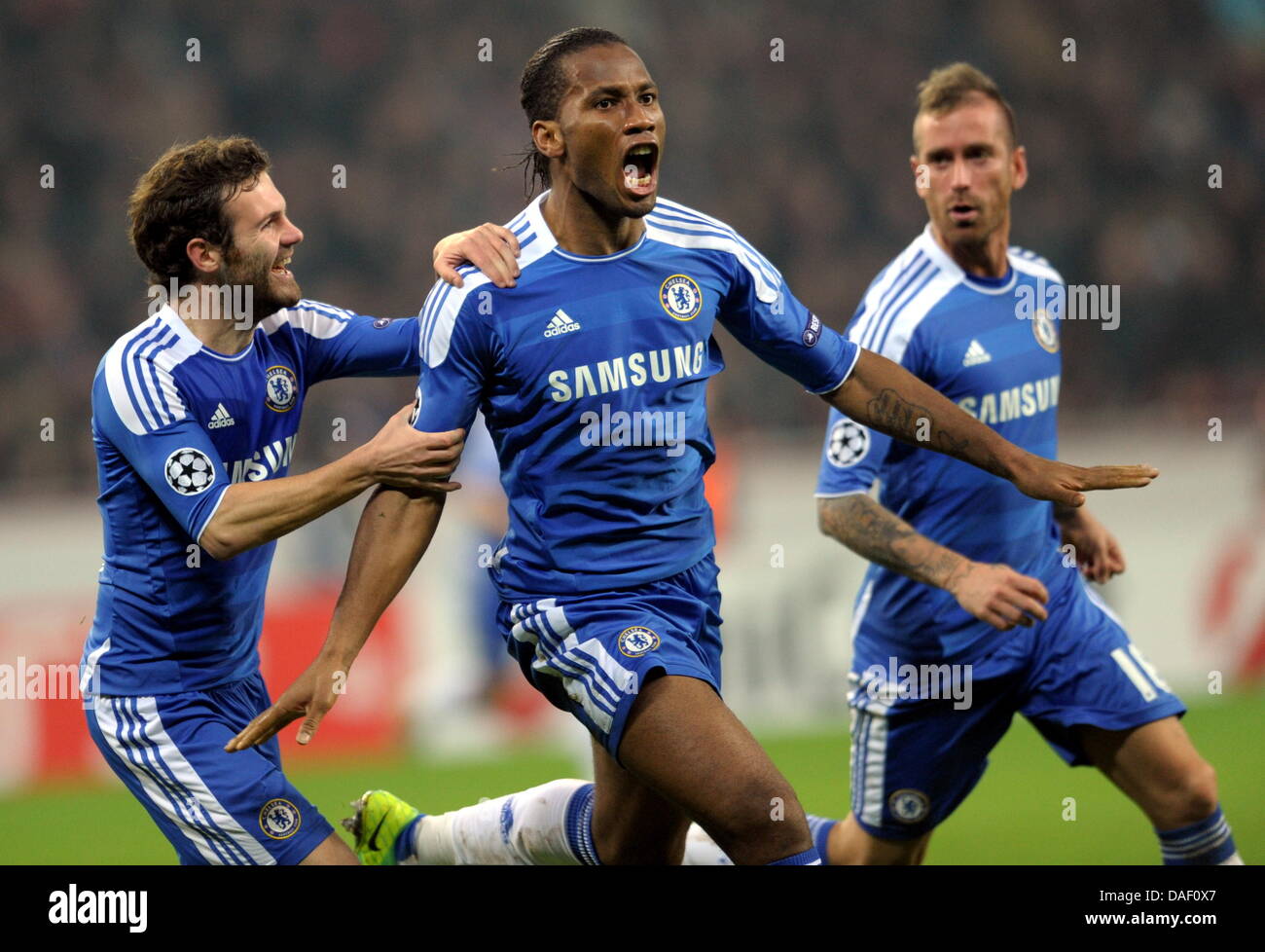 Juan Mata (L-R), Didier Drogba and Raul Meireles of Chelsea ...
