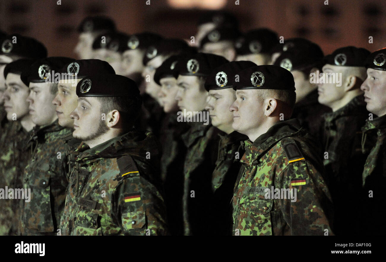 Soldiers of the armoured infantry brigade 37 muster at the Wettiner barracks in Frankenberg, Germany, 23 November 2011. About 200 soldiers of the German Bundeswehr start their foreign assignment in Afghanistan and Kosovo after the roll-call. Photo: Hendrik Schmidt Stock Photo