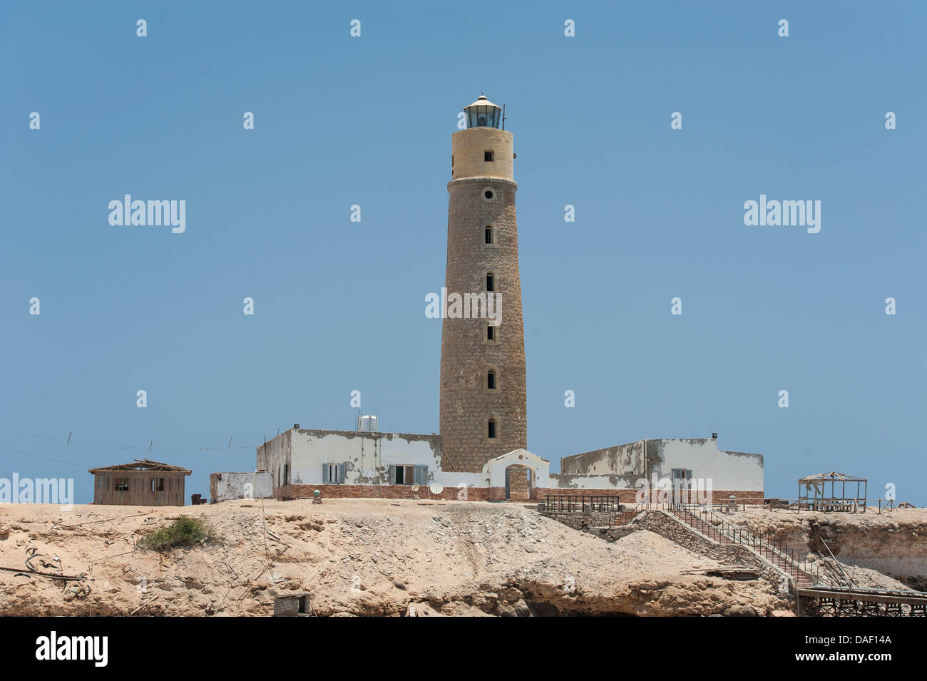 Old lighthouse building on an offshore Egyptian Island in the Red Sea Stock Photo