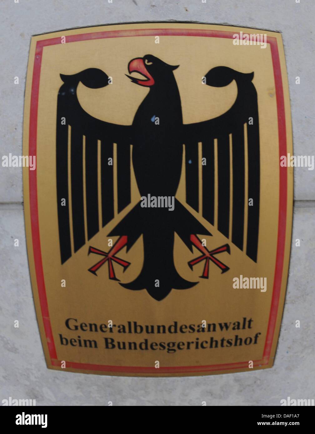 The coat of arms of the German Federal Public Prosecutor is pictured in Karlsruhe, Germany, 24 November 2011. Andre E. is being brought to Karlsruhe for a detention hearing at the Federal Court. He is accused in two cases of supporting the right-wing radical, terrorist association NSU ('National Socialist Underground'). Special operations unit from GSG 9 arrested the 32 year old An Stock Photo