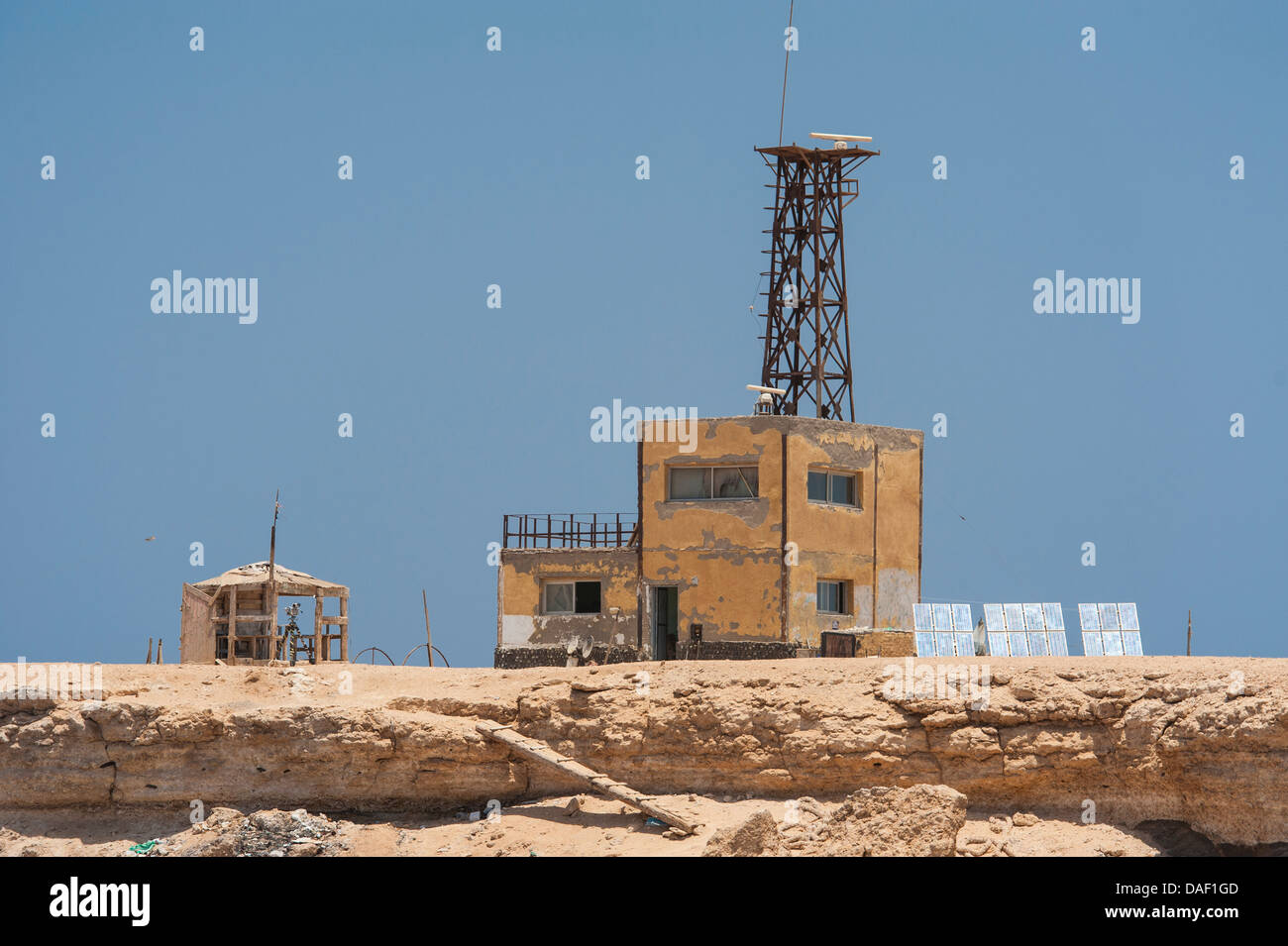 Old coastguard building with radar on an offshore Egyptian Island in the Red Sea Stock Photo