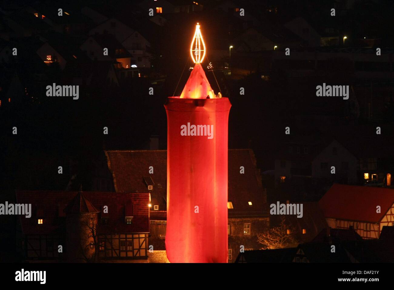 A tower has been veiled in red cloth to symbolize the 'biggest candle