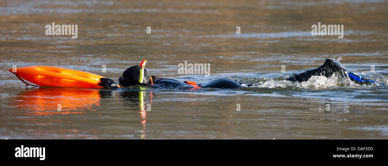 A Polish extreme sports athlete swims wearing a wetsuit in the German