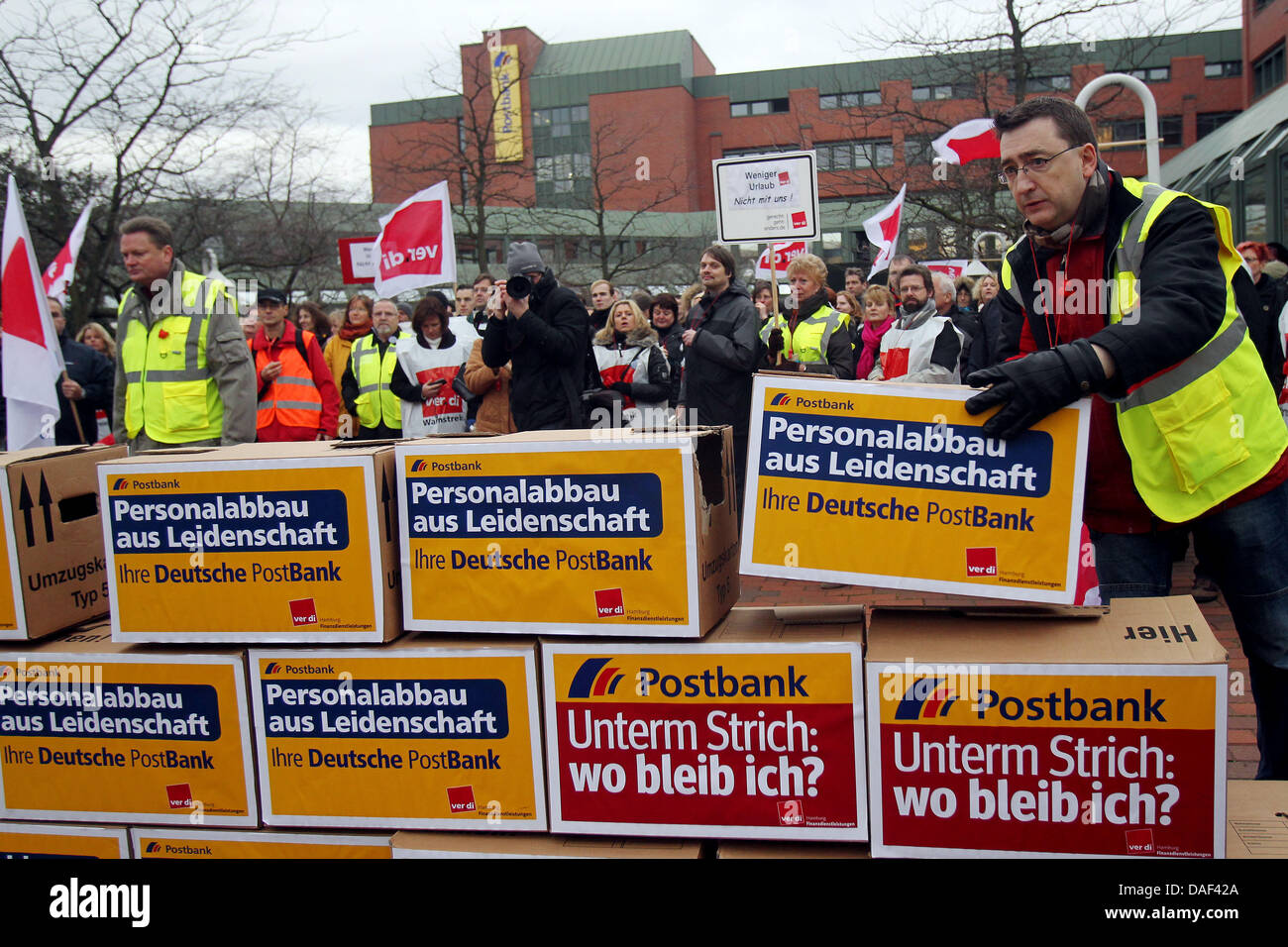 Staff members of the German retail bank Postbank pile boxes lettered with protest slogans during a warning strike in front of the headquarters in Hamburg, Germany, 01 December 2011. The union Verdi called for a nationwide warning strike of around 22,000 Postbank employees. Photo: MALTE CHRISTIANS Stock Photo