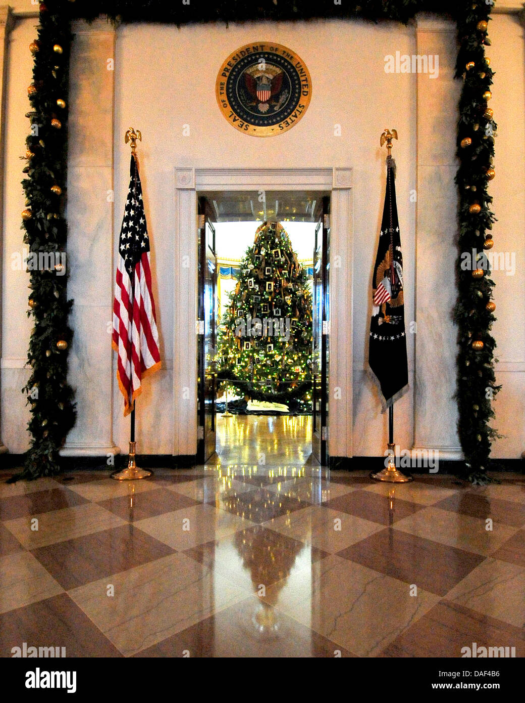 The White House Christmas tree is seen in the Blue Room looking from the Grand Foyer at the