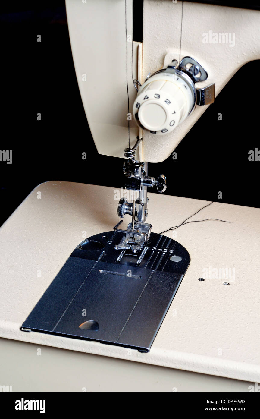 Sewing machine foot plate and needle Stock Photo Alamy