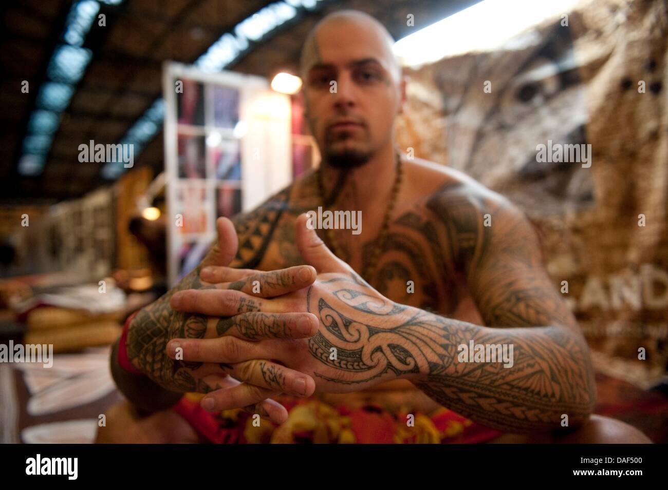 Julien Ruiz from France shows his tattoos at the 21st international tatto convention in Berlin, Germany, 02 December 2011. OVer 200 tattoo artists, 180 from abroad, are showing the newest tattoo techniques, design and color creations until Sunday, 04 December 2011. Photo: SEBASTIAN KAHNERT Stock Photo
