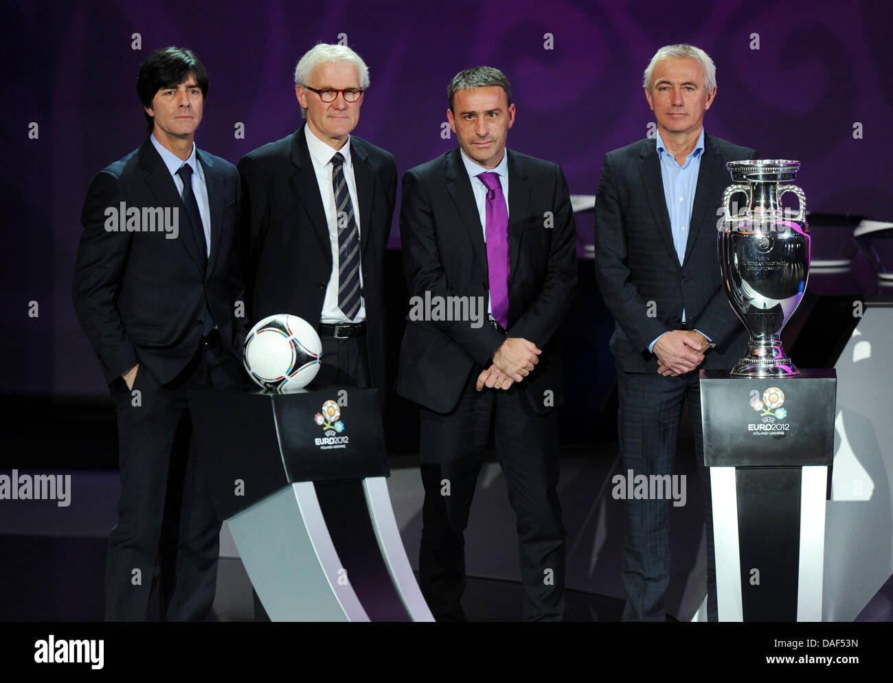 The coaches of group B Joachim Löw (Germany), Morton Olson (Denmark), Paulo Bento (Portugal) and Bert van Marwijk (Netherlands, from left to right)) stay at the stage during the final draw for the UEFA EURO 2012 soccer championships at the Palace of Arts in Kiev, Ukraine, 02 December 2012. The European soccer championships will take place from 08 June to 01 July 2012 in Poland and  Stock Photo