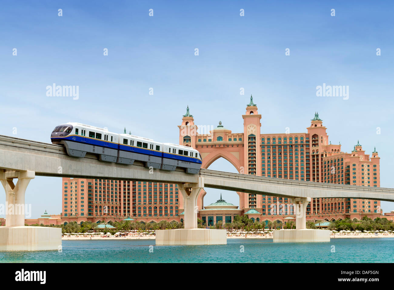 Monorail train approaching The Palm Atlantis luxury hotel on artificial Palm Jumeirah island in Dubai United Arab Emirates Stock Photo