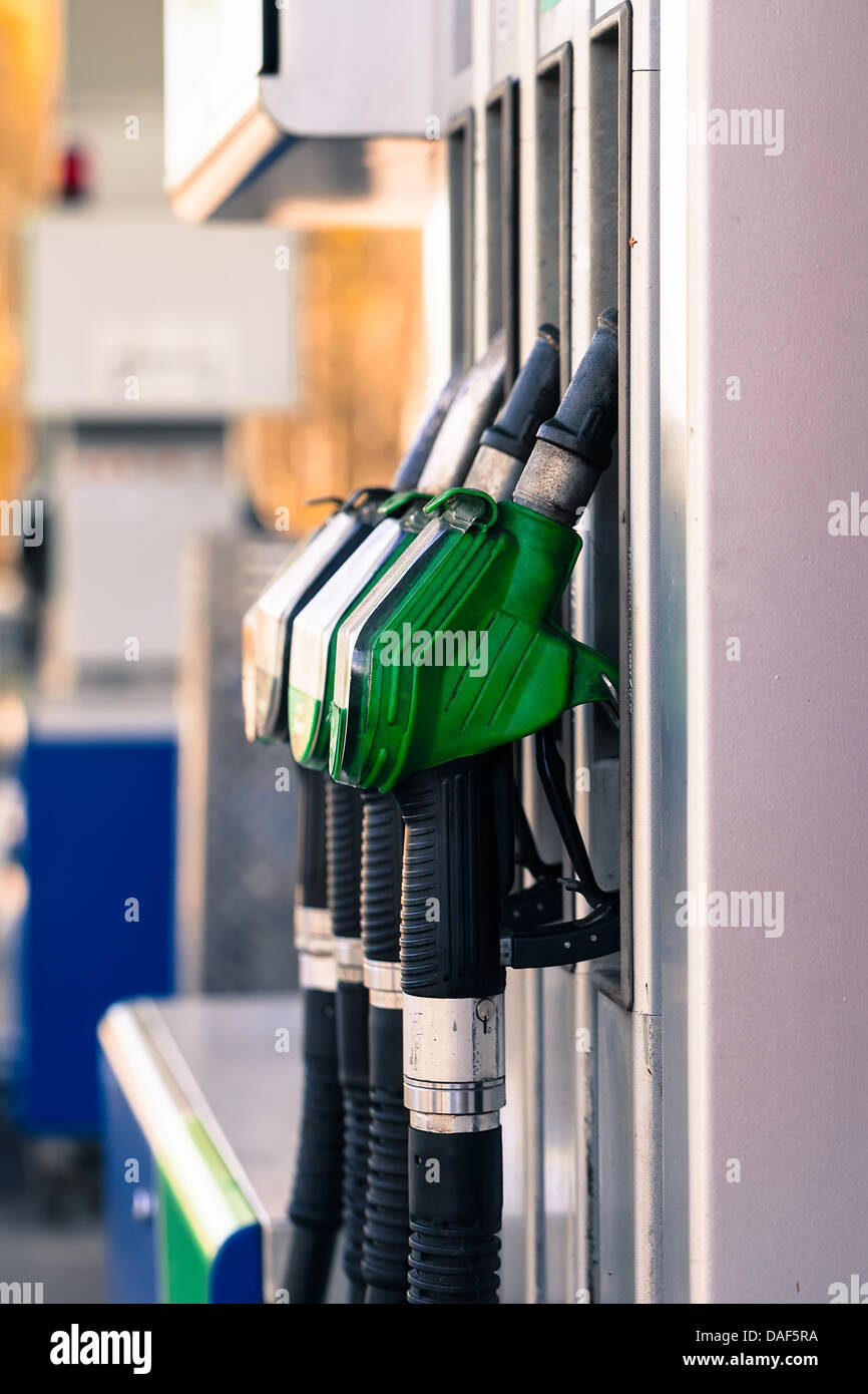Pump nozzles at the gas station Stock Photo Alamy