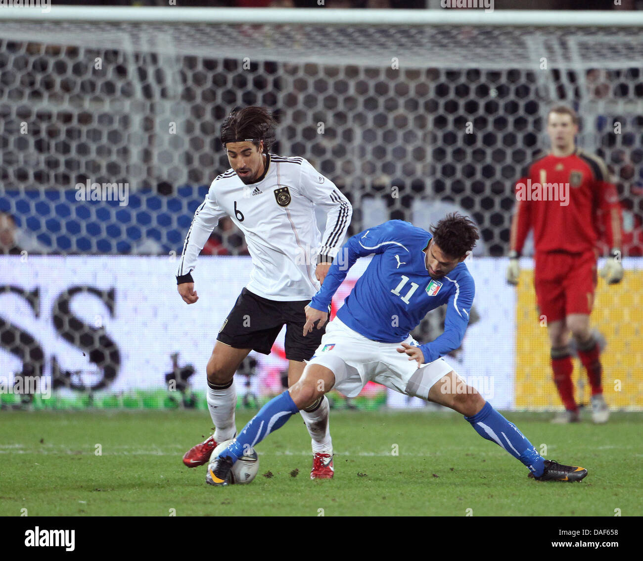 Germany's Sami Khedira (L) and Marco Borriello (R) of Italy fight for the ball during the friendly soccer match between Germany and Italy at Signal Iduna Park stadium in Dortmund, Germany, 09 February 2011. Photo: Friso Gentsch Stock Photo