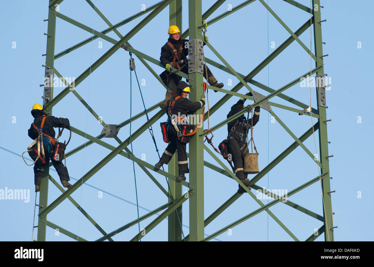 Construction workers on a pylon 30 meters above the ground in Bernau, Germany on 8 February 2011