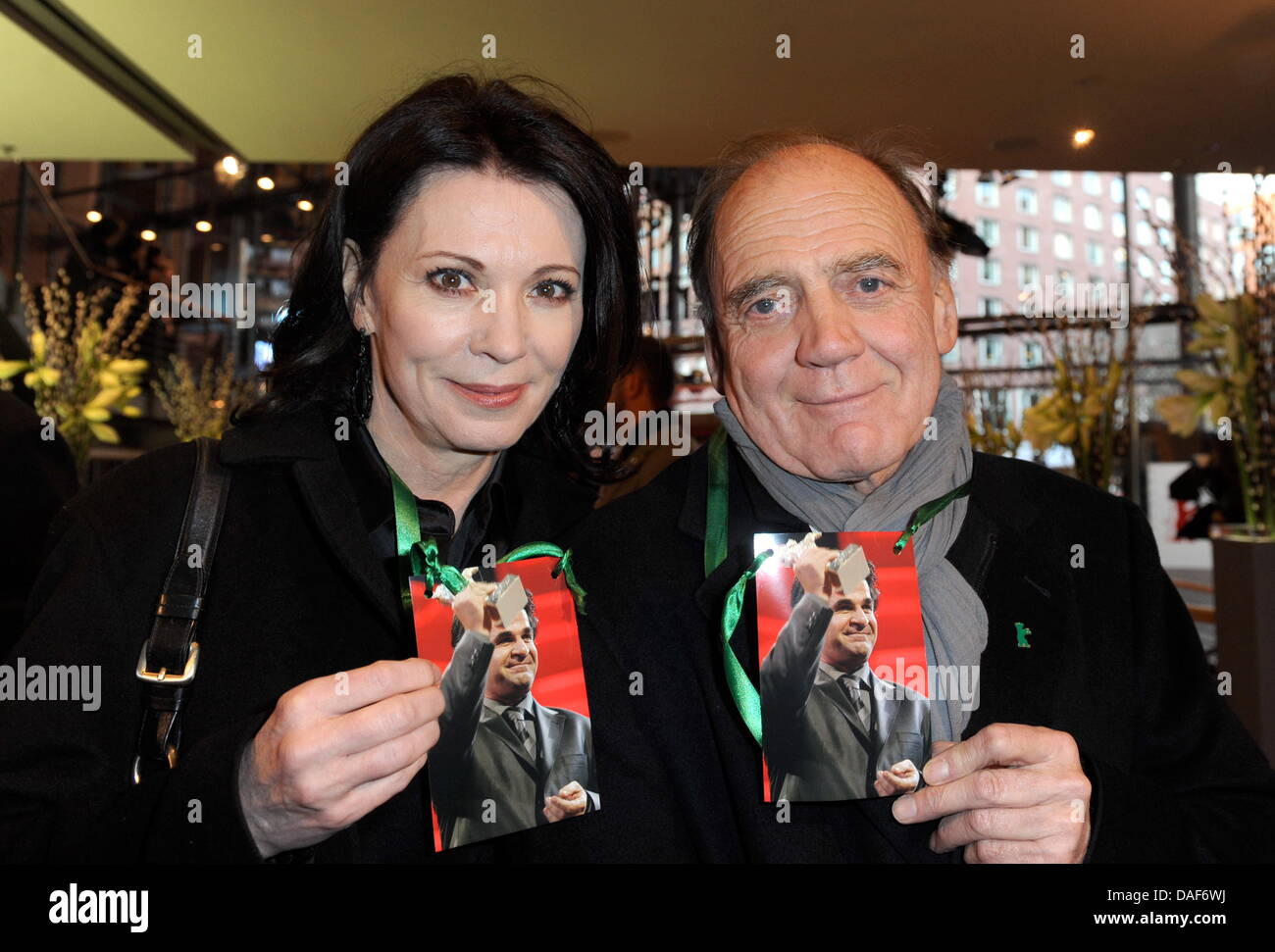 Actors Iris Berben and Bruno Ganz arrive for the premiere of the movie 'Offside' showing a picture of director Iranian director Jafar Panahi during the 61st Berlin International Film Festival in Berlin, Germany on 11 February 2011. The film is running in the Competition's Special Screening of the International Film Festival. The 61st Berlinale takes place from 10 to 20 February 201 Stock Photo