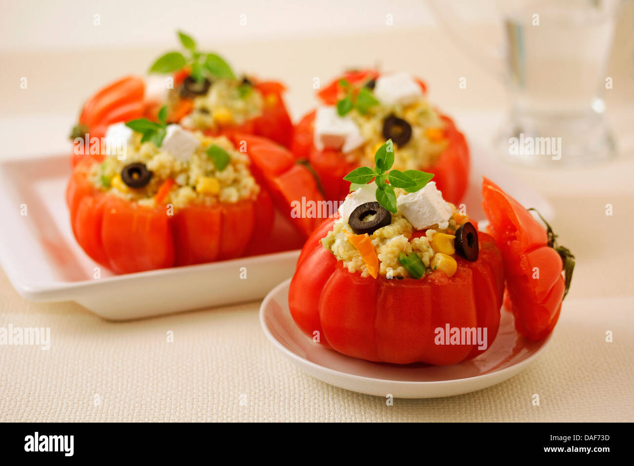 Stuffed tomatoes with millet. Recipe available. Stock Photo