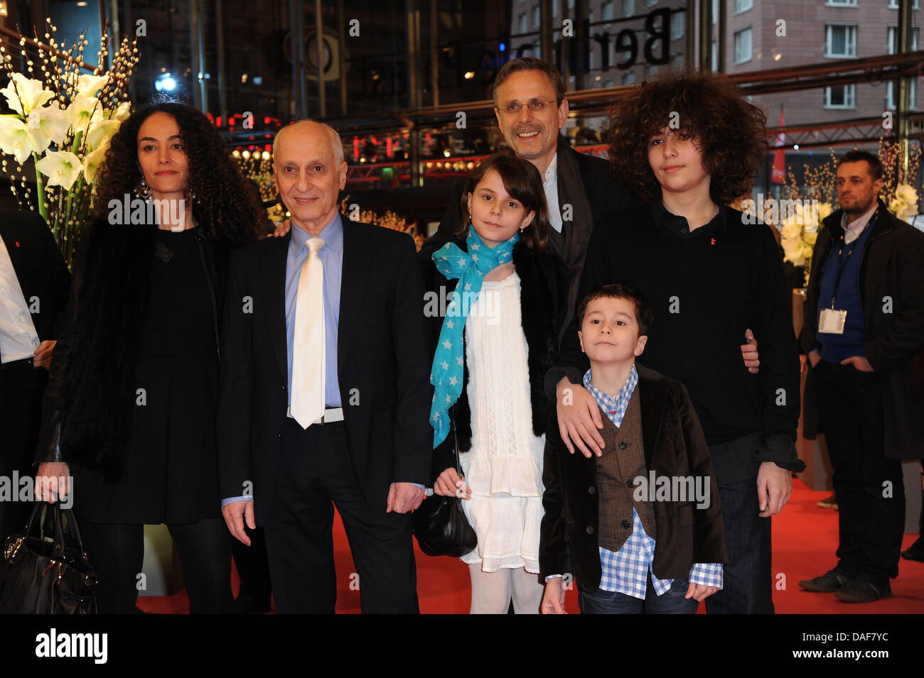 French director Michel Ocelot (2ndL) and producer Christophe Rossignon (back) arrive with family members for the premiere of the animationsfilm 'Tales Of The Night' ('Les Contes De La Nuit') during the 61st Berlin International Film Festival in Berlin, Germany, 13 February 2011. The film runs in the competition of the International Film Festival. The 61st Berlinale takes place from Stock Photo