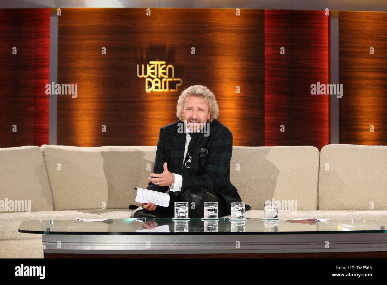 German TV host Thomas Gottschalk gestures on stage during live