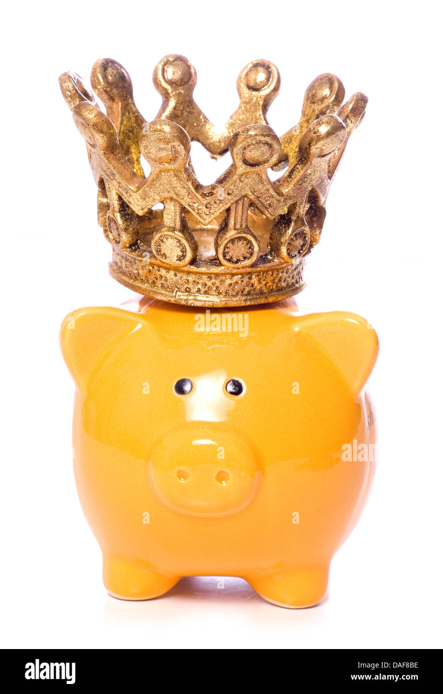 Piggybank with crown studio cutout Stock Photo Alamy