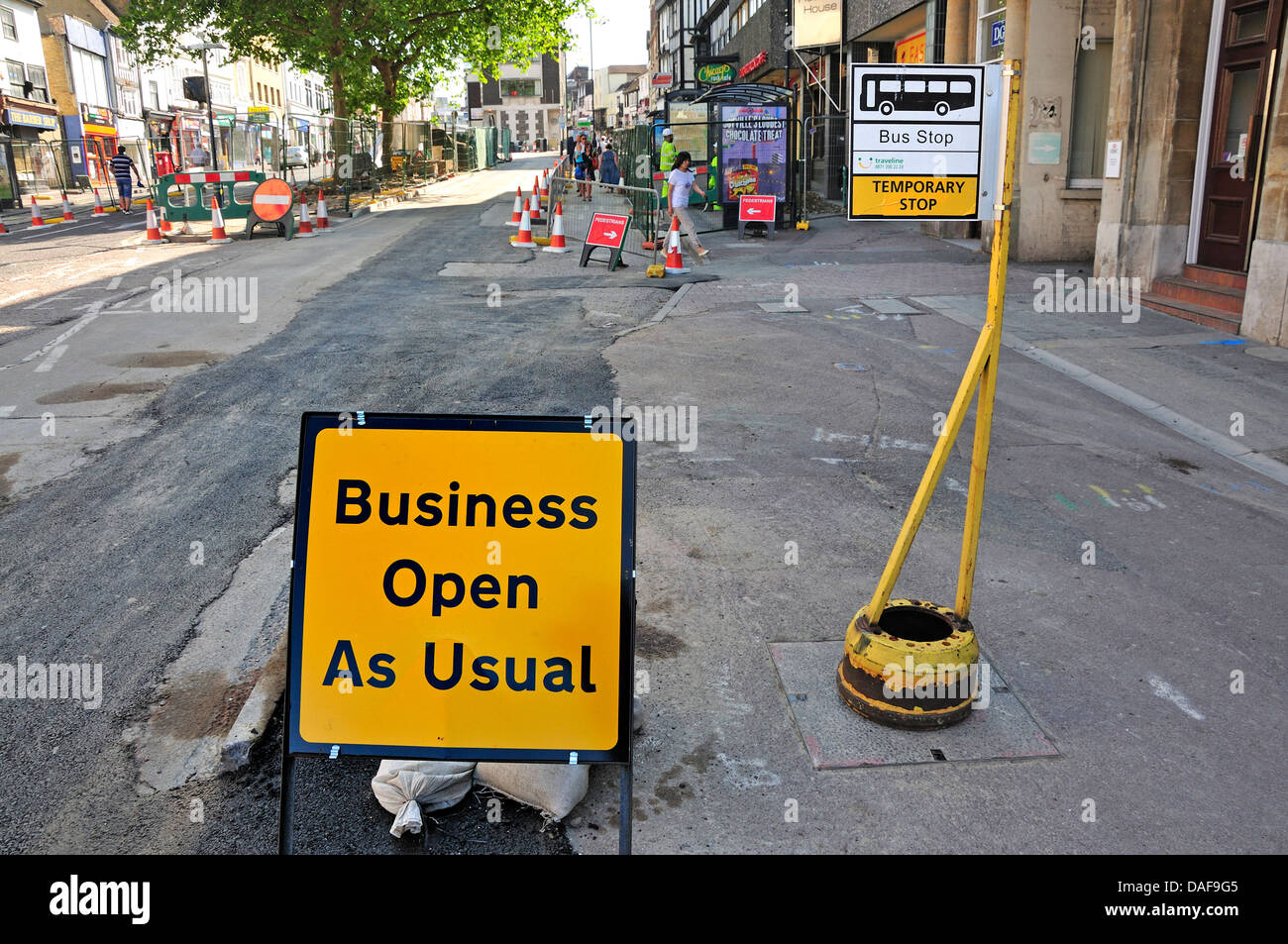 Maidstone, Kent, England. Roadworks - 'Business as usual' sign. Temporary bus stop Stock Photo