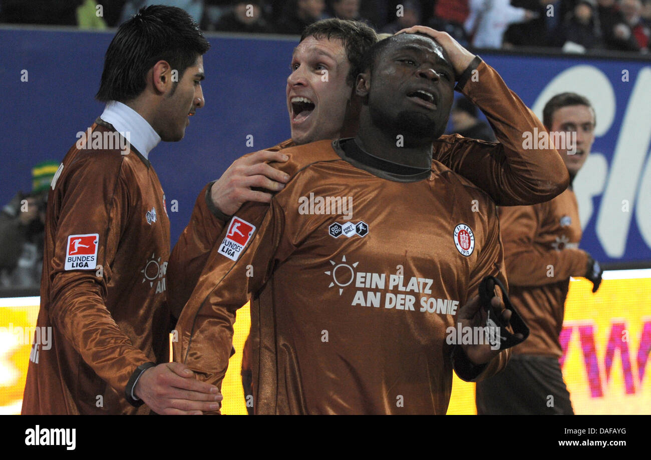 St. Pauli's Gerald Asamoah (front) cheers after his 1-0 goal with his teammate Moritz Volz during the Bundesliga match Hamburger SV vs. FC St. Pauli at the Imtech Arena in Hamburg, Germany, 16 February 2011. Photo: Marcus Brandt Stock Photo