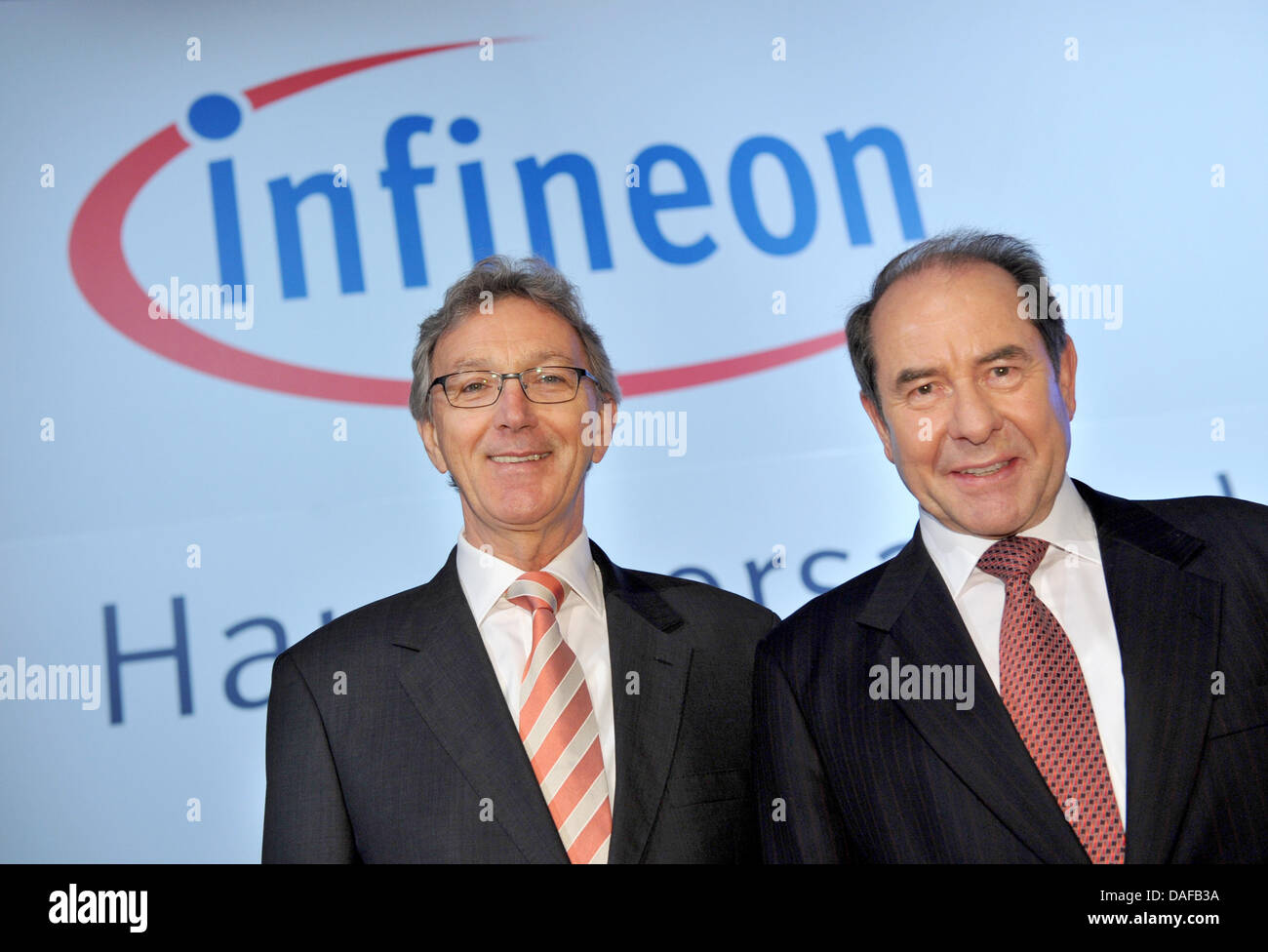 Prospective new chairman of the supervisory board of semiconductor manufacturer 'Infineon' Wolfgang Mayrhuber (L) and the present chairman Klaus Wucherer shake hands during the general meeting in Munich, Germany, 17 February 2011. Photo: ANDREAS GEBERT Stock Photo