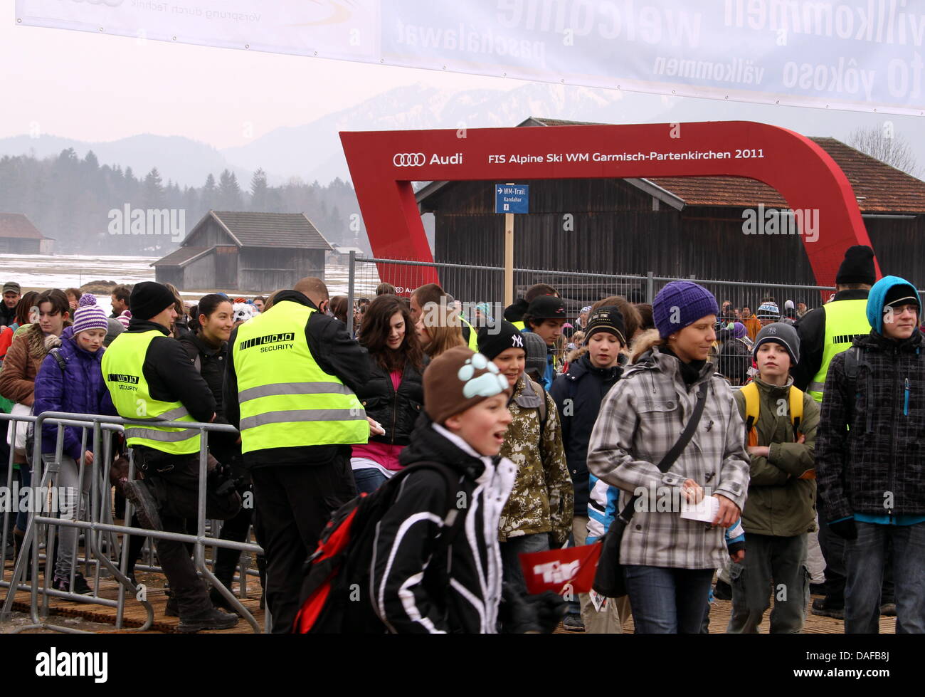 Spectators are searched at a security checkpoint before entering the Kandahar Arena during the Alpine Skiing World Cup 2011, in Garmisch-Partenkirchen, Germany, 16 February 2011. Photo: Stephan Jansen Stock Photo