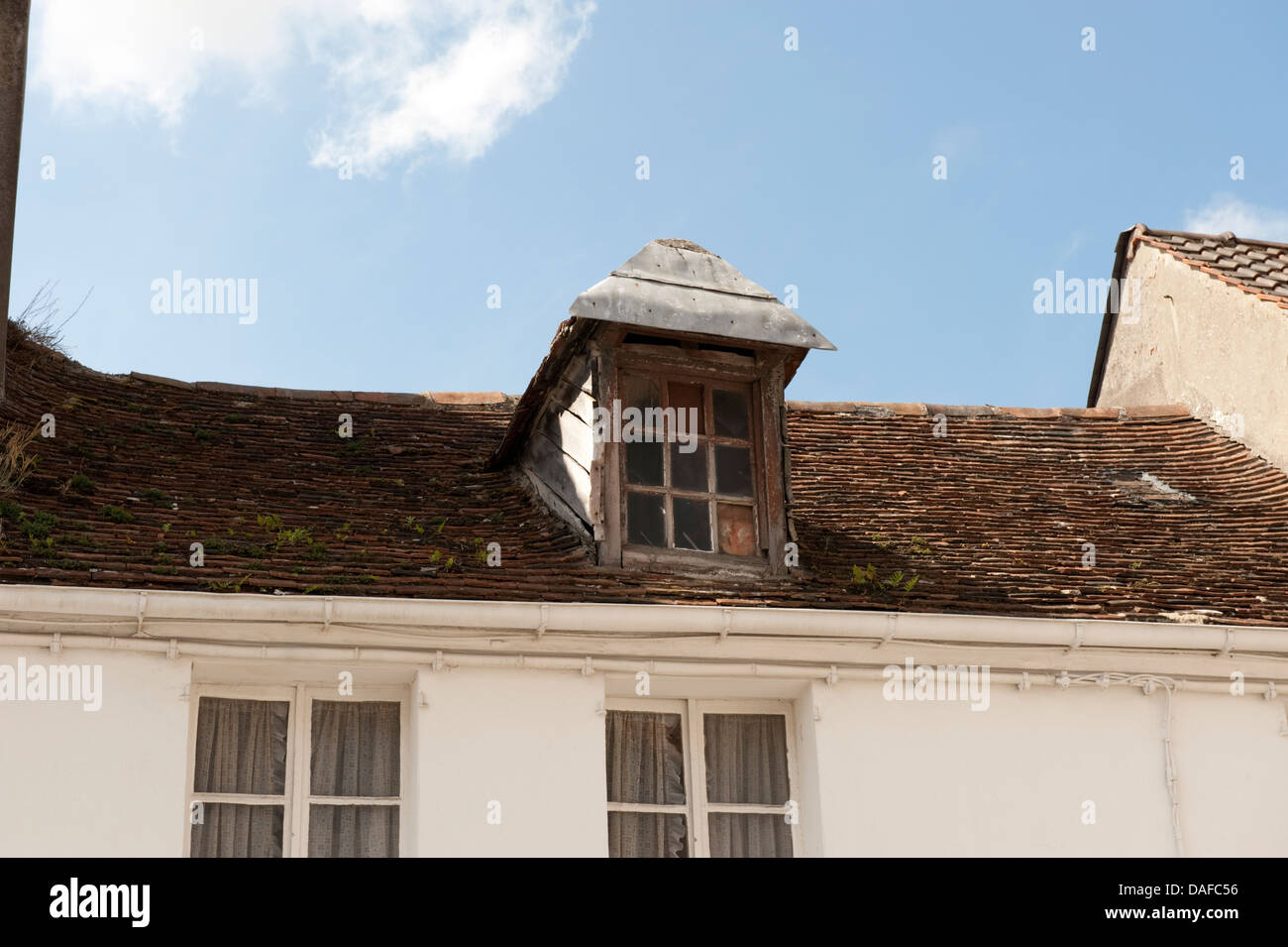 Old weathered dilapidated dormer roof Montreuil France Stock Photo