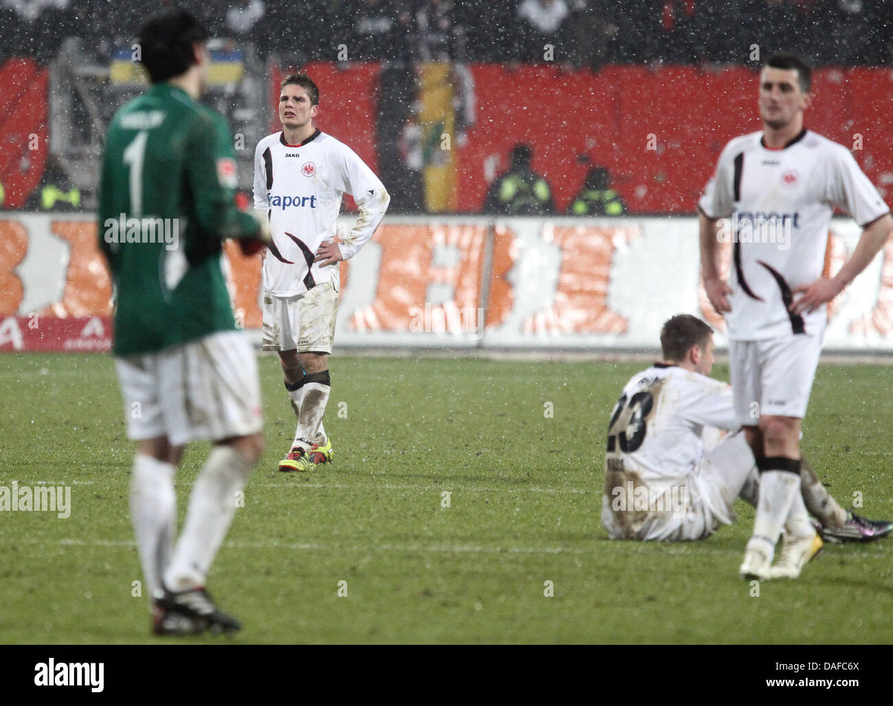Frankfurt's players stand disappointed on the pitch after the final whistle in the Bundesliga soccer match between  1st FC Nuremberg vs Eintracht Frankfurt  1st FC Nuremberg vs Eintracht Frankfurt at the easyCredit soccer stadium in Nuremberg, Germany, 18 February 2011. Nuremberg won 3-0. Photo: Daniel Karmann Stock Photo