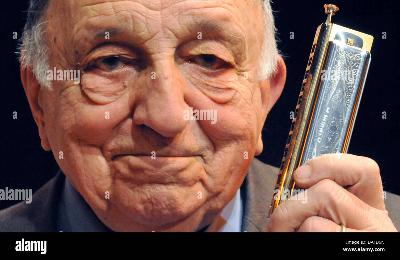 Italian harmonica legend Franco De Gemini plays his harmonica during a