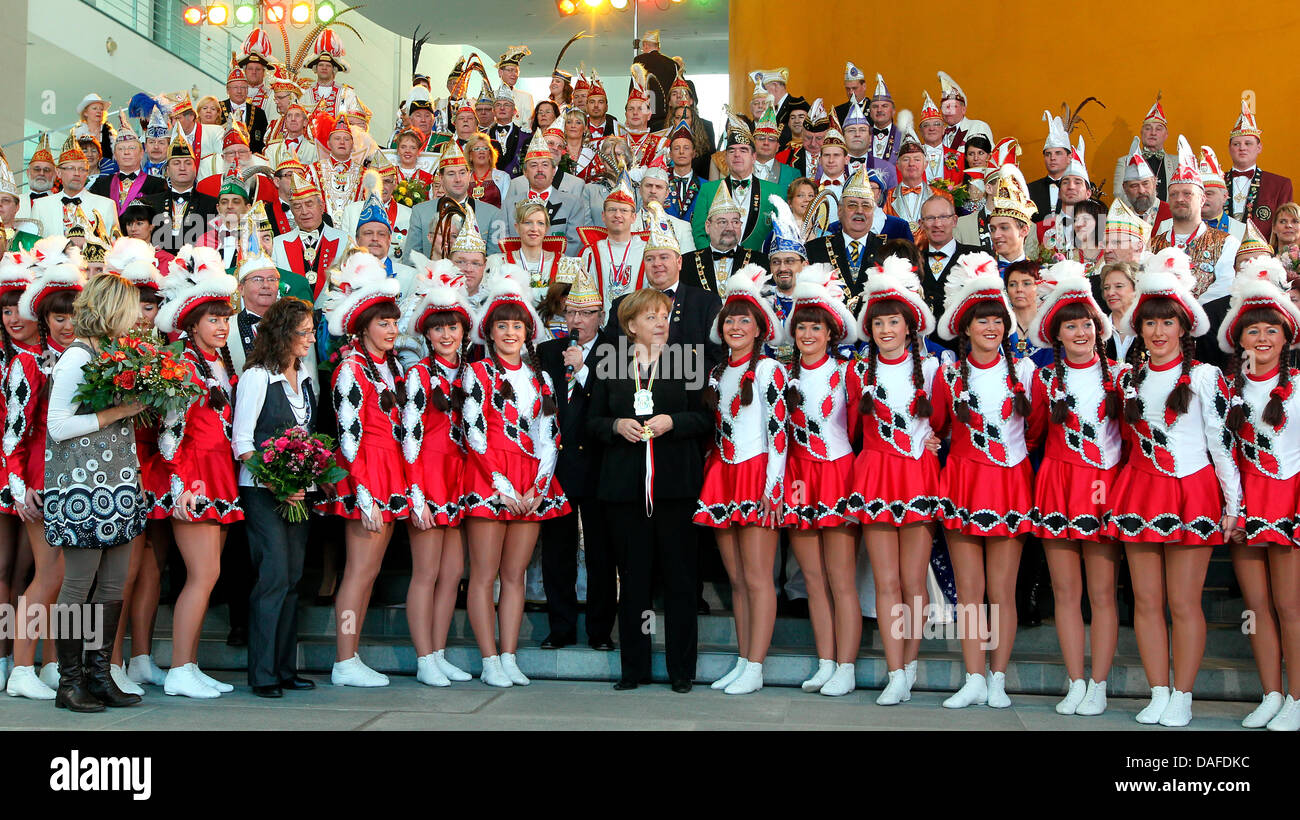 German Chancellor Angela Merkel (C) receives members of Baunatal-based carnival association 'GCC' in Berlin, Germany, 22 February 2011. Photo: Wolfgang Kumm Stock Photo