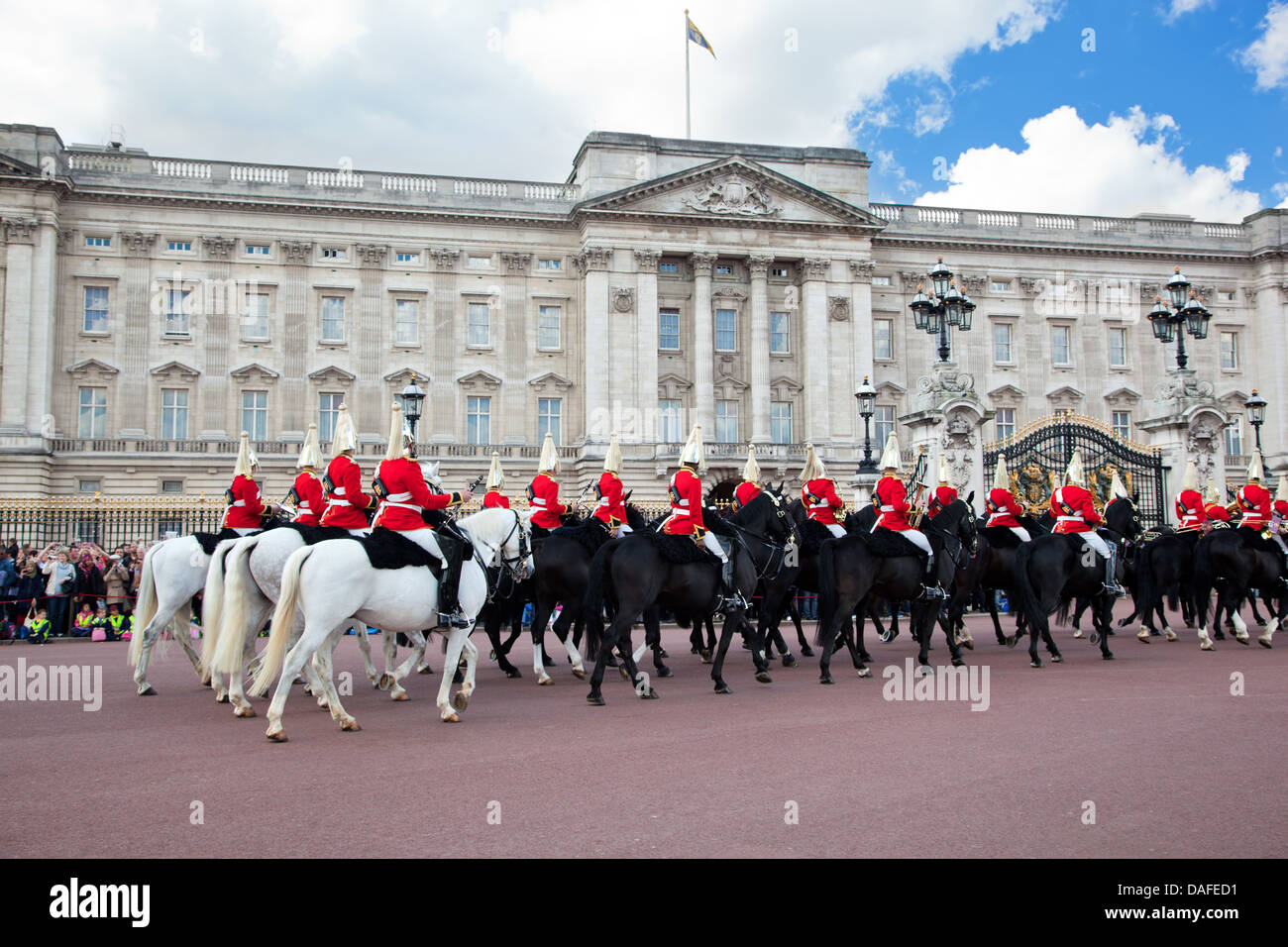 LONDON - MAY 17: British Royal guards riding on horse and perform the Changing of the Guard in Buckingham Palace on May 17, 2013 Stock Photo