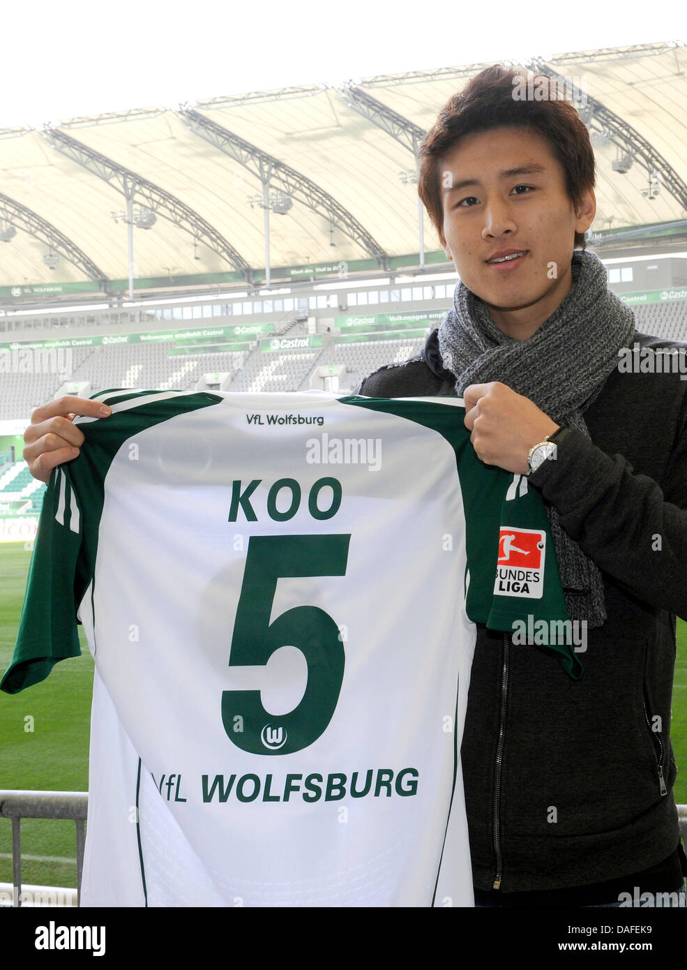 German Bundesliga club VfL Wolfsburg's new signed midfielder Koo Ja-Cheol poses with his jersey in Wolfsburg, Germany, 23 February 2011. South Korea international Koo penned a three-and-a-half contract. Photo: HOLGER HOLLEMANN Stock Photo