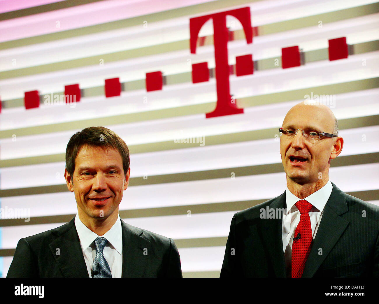 Deutsche Telekom CEO Rene Obermann (L) and CFO Timotheus Hoettges (R) arrive for the telecommunication group's balance press conference in Bonn, Germany, 25 February 2011. Photo: OLIVER BERG Stock Photo