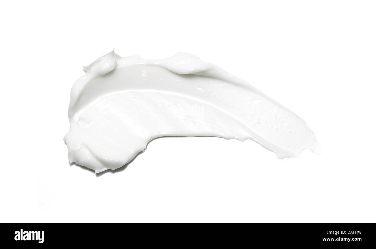 sweep of white beauty cream oil gel product cut out onto a white