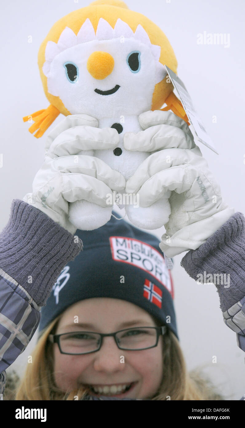 Norwegian Anna holds the mascot fnugg during the Ski Jumping of the Nordic Combined event at the Nordic Skiing World Championships in Oslo, Norway, 26 February 2011. Photo: Patrick Seeger dpa Stock Photo