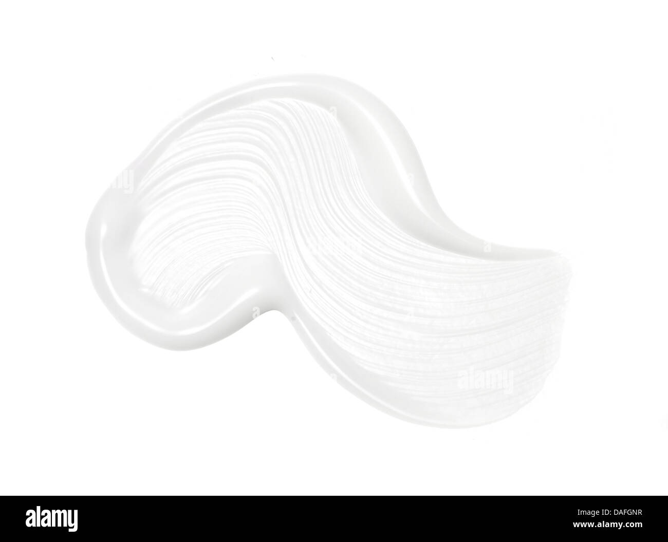 sweep of white beauty cream oil gel product cut out onto a white background Stock Photo