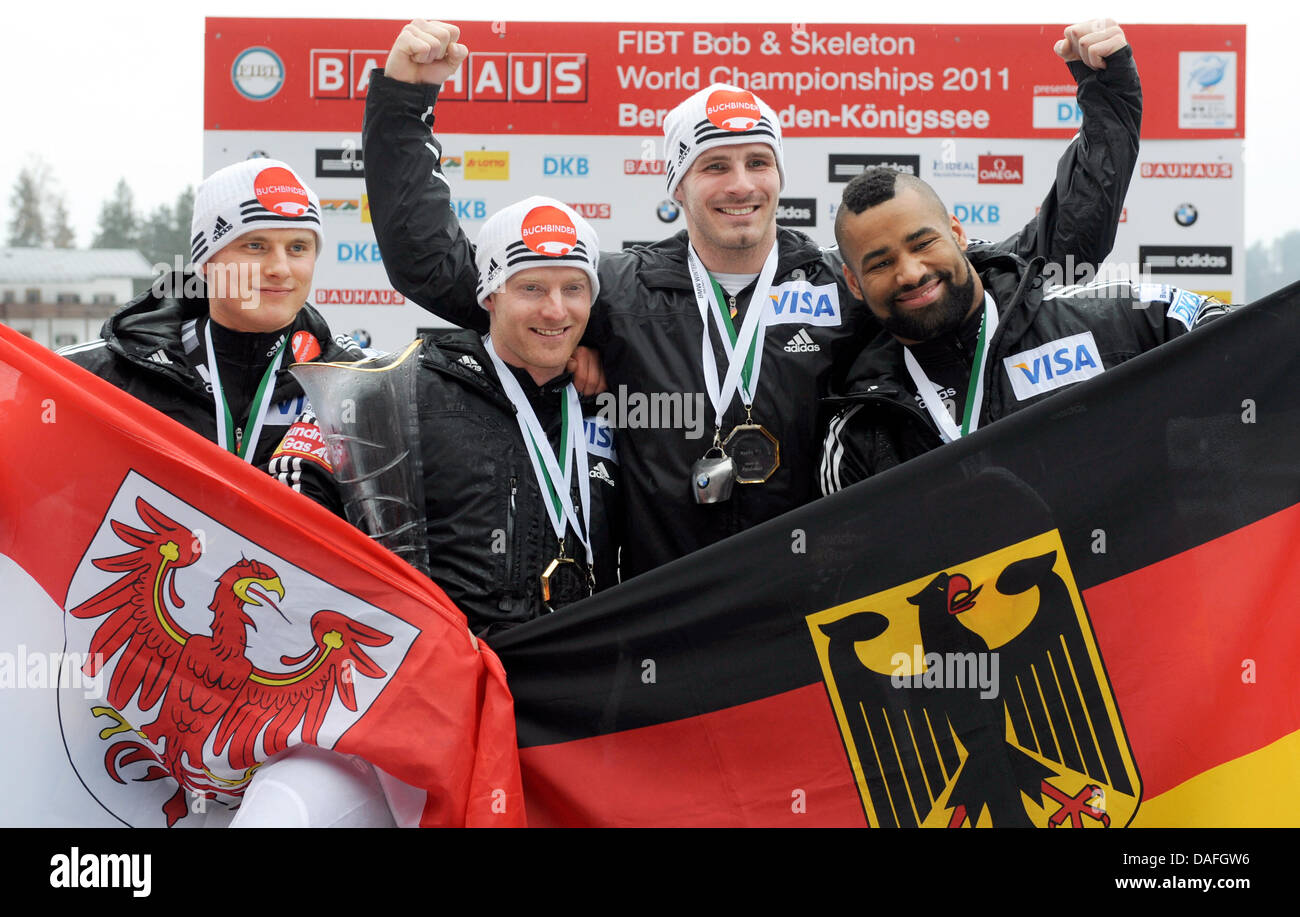 German bob pilot Manuel Machata (2-l) and pushers Andreas Bredau (2-r), Richard Adjei (r)and Christian Poser make first place in the four-man bob category competition and attend the medal ceremony during the Bobsleigh World Championships at Koenigssee, Germany, 27 February 2011. The Bobsleigh and Skeleton WC ends with this final category. Photo: Tobias Hase Stock Photo
