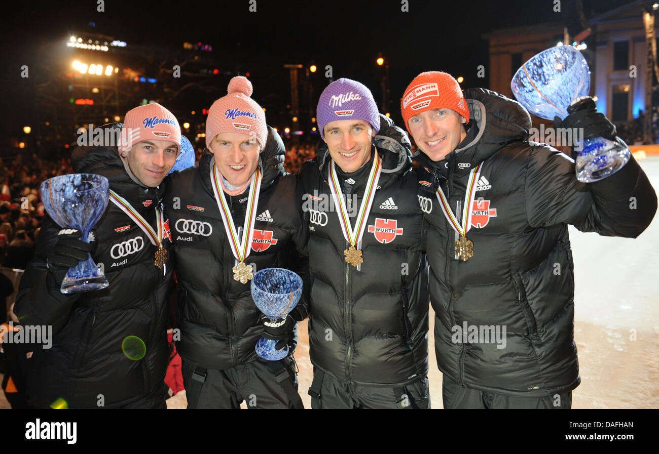 Bronze medalists Martin Schmitt (L-R), Severin Freund, Michael Uhrmann and Michael Neumayer of Germany show their medals during the medal ceremony after the Men's Ski Jumping Normal Hill team event at the FIS Nordic Skiing World Championships in Oslo, Norway, 27 February 2011. Photo: Hendrik Schmidt Stock Photo