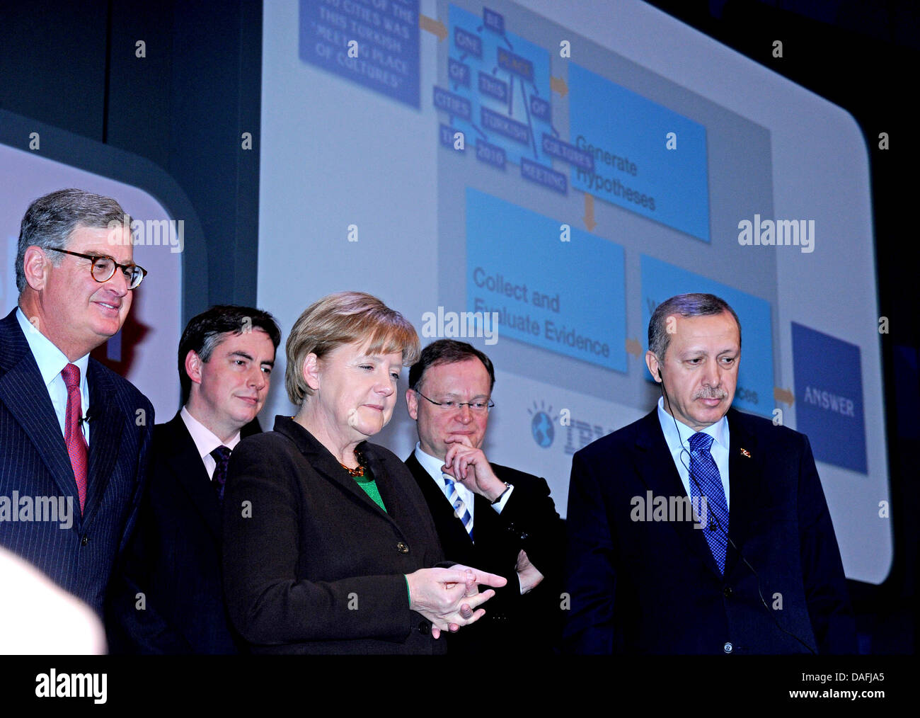German Chancellor Angela Merkel (3-l), the head of IBM Sam Palmisano (l-r), Lower Saxony's Prime Minister David Mc Allister, the first mayor of Hanover Stephan Weil and Turkish Prime Minister Recep Tayyip Erdogan attend the inauguration of the Cebit Computer Expo in front of the supercomputer Watson in Hanover, Germany, 28 February 2011. Cebit will present over 4200 companies from  Stock Photo